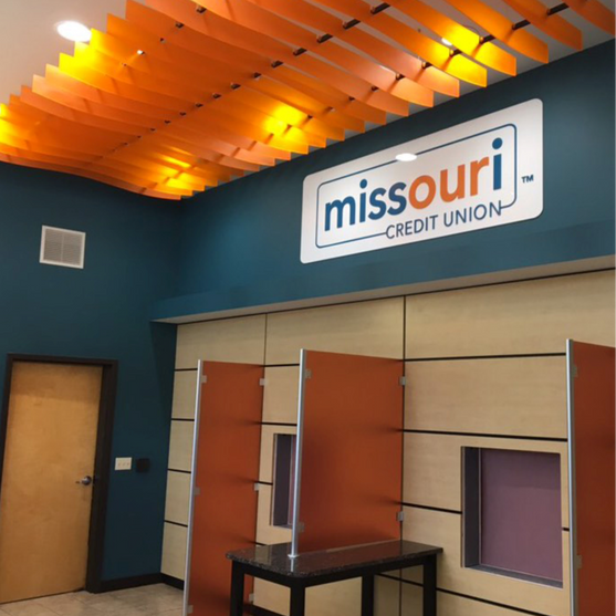 Missouri Credit Union interior with colorful ceiling and ATM machines.