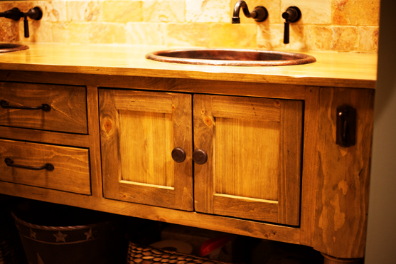 Wooden bathroom vanity with sink and cabinets