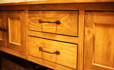 Rustic wooden cabinet with two drawers and metal handles